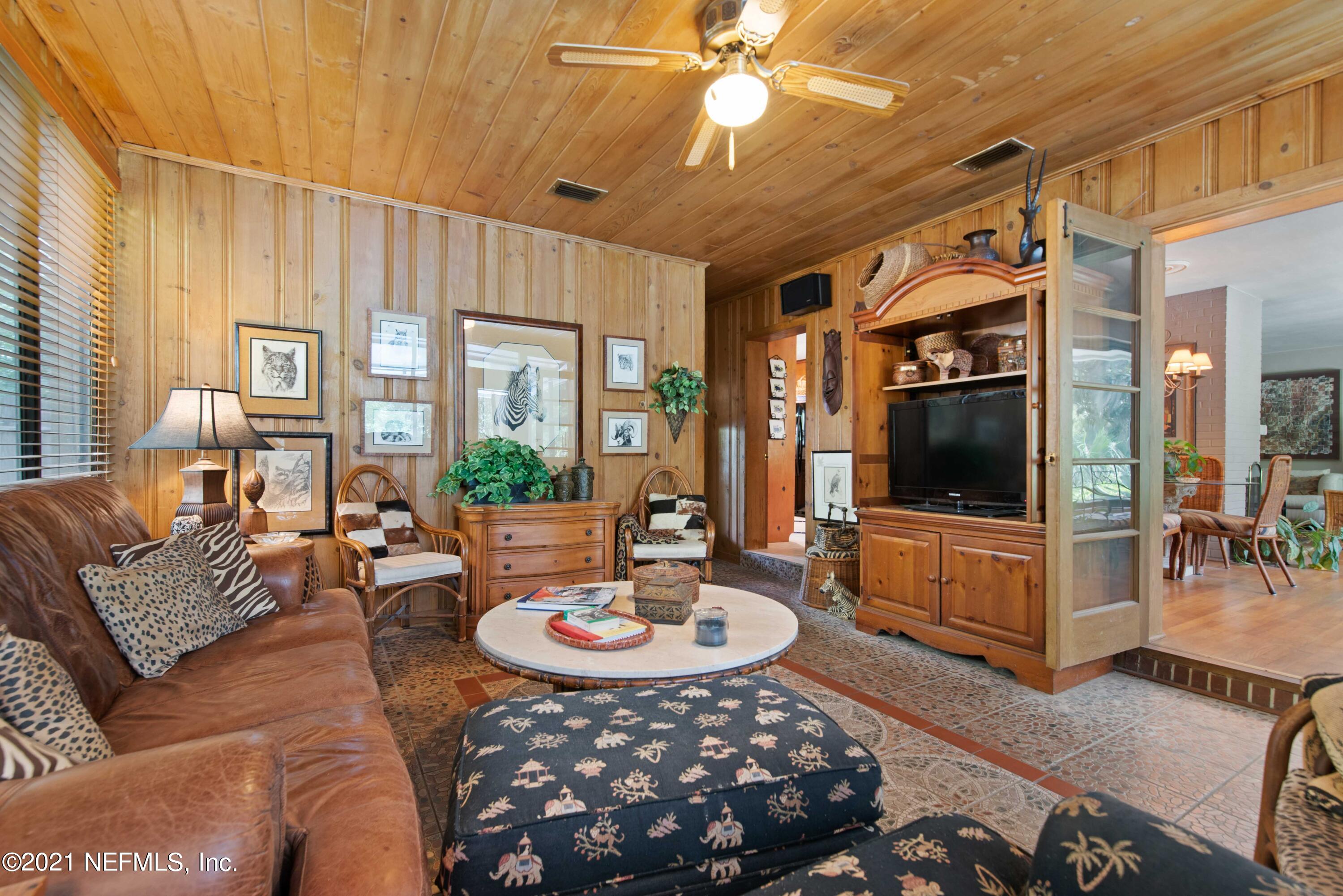 6514 Colgate Road Jacksonville, FL 32217 - Photo 13 of 31 a living room with furniture and a flat screen tv