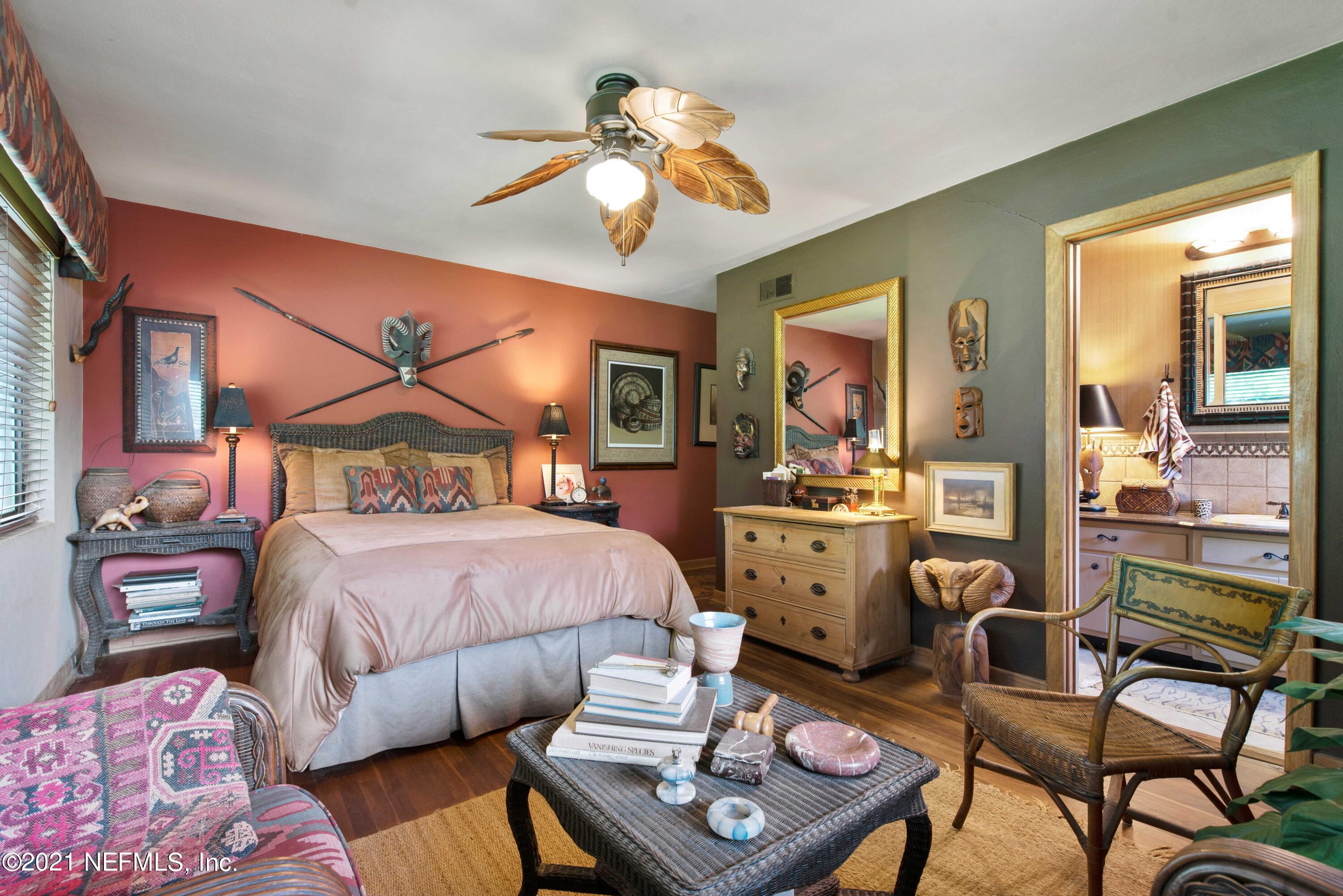 6514 Colgate Road Jacksonville, FL 32217 - Photo 16 of 31 a bedroom with a bed and wooden floor