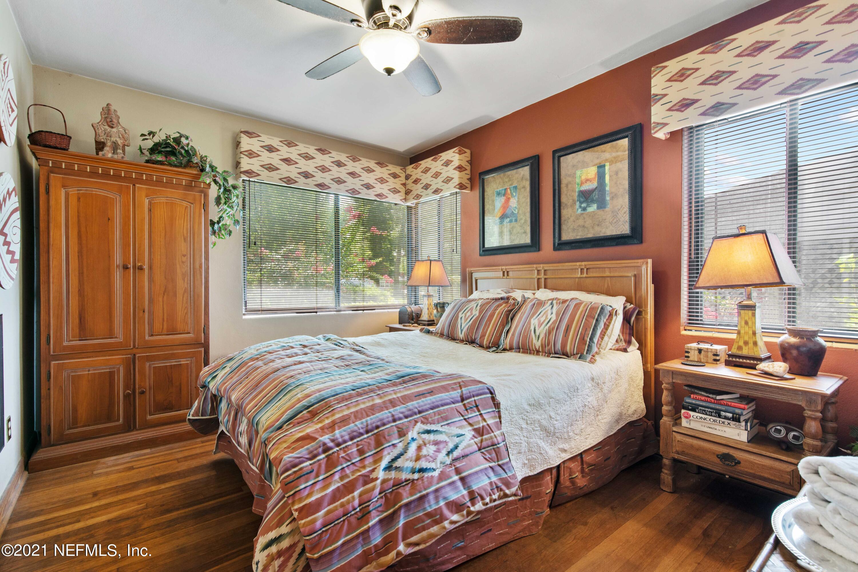 6514 Colgate Road Jacksonville, FL 32217 - Photo 20 of 31 a bedroom with a bed and wooden floor