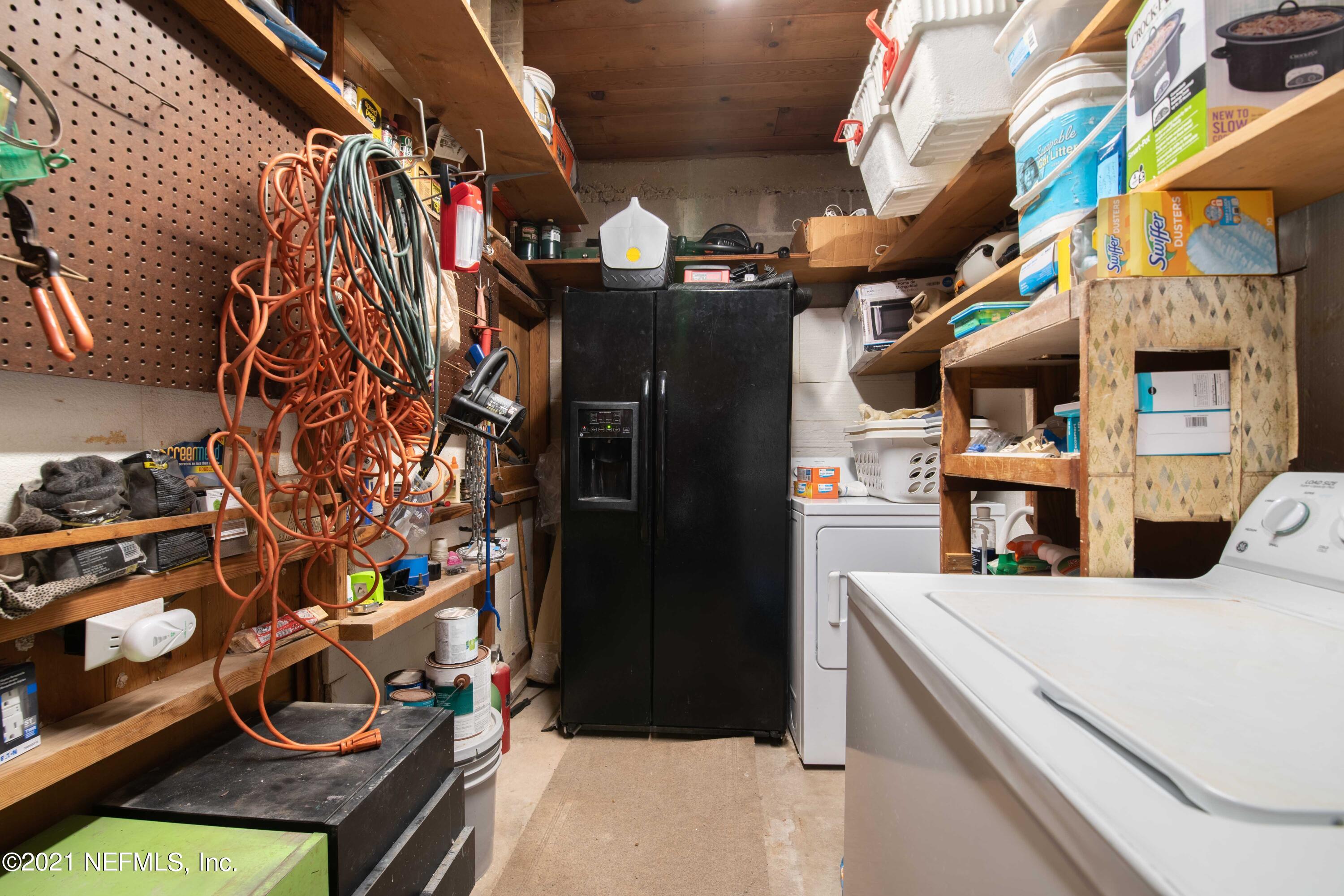 6514 Colgate Road Jacksonville, FL 32217 - Photo 21 of 31 a view of walk in closet with clothes and shoes