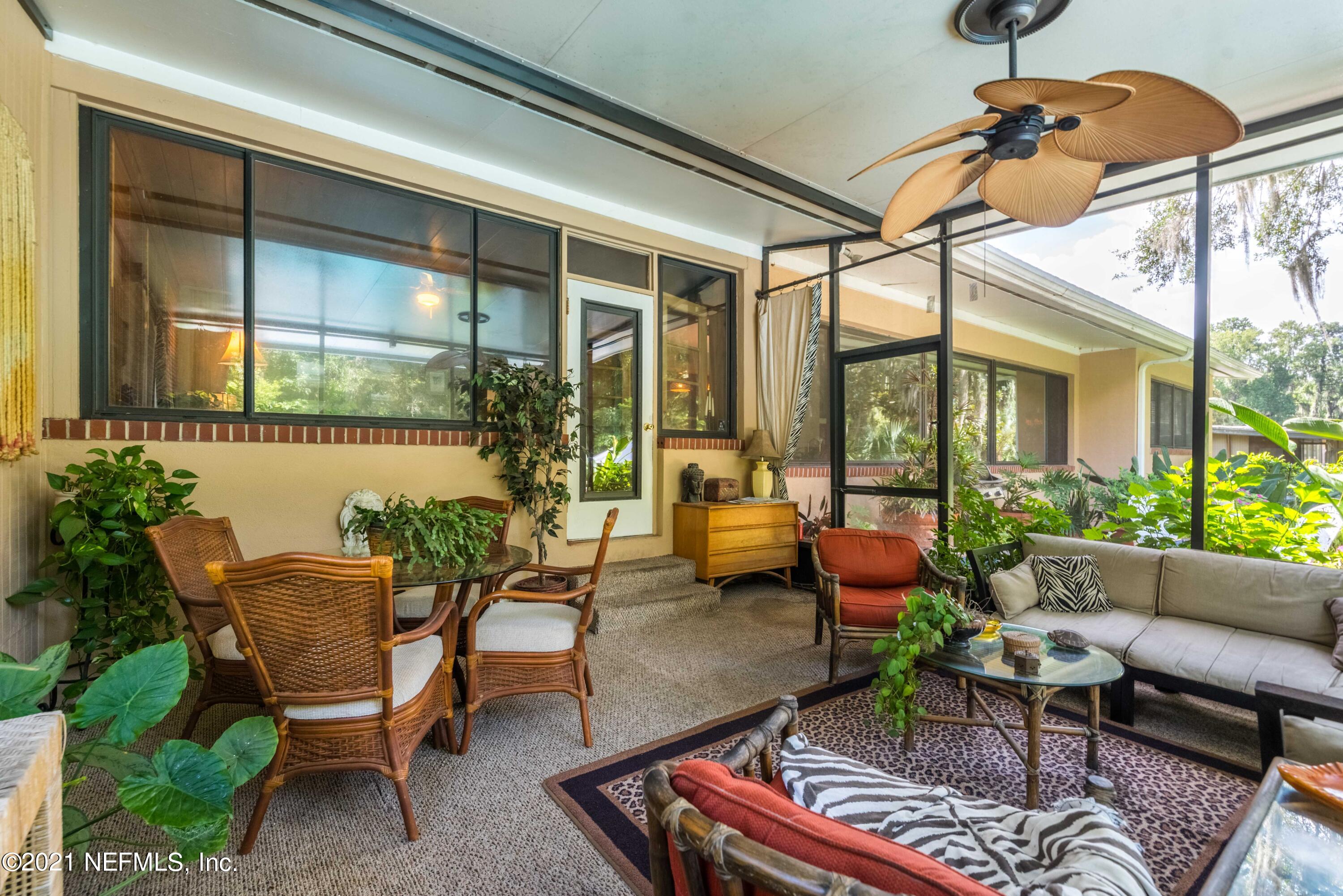 6514 Colgate Road Jacksonville, FL 32217 - Photo 22 of 31 a balcony with furniture and a potted plant