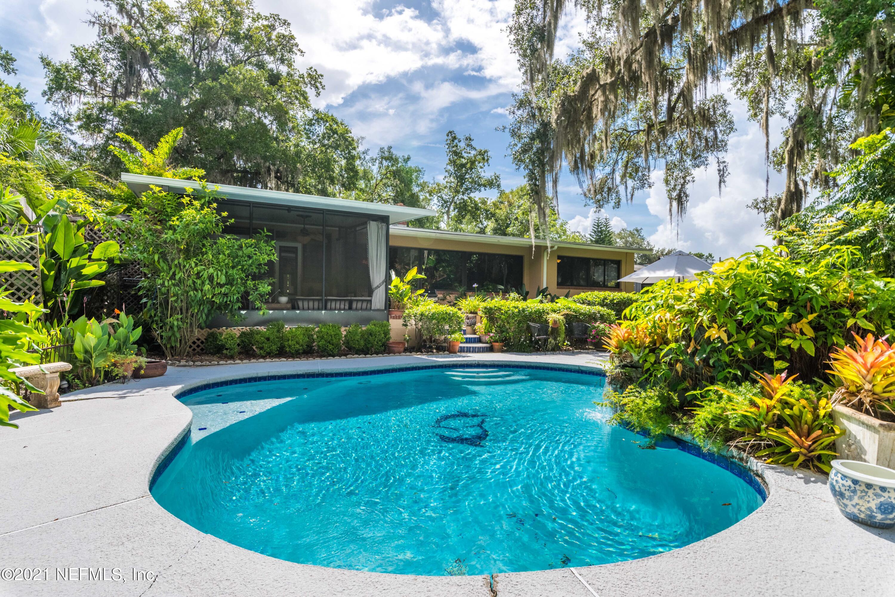 6514 Colgate Road Jacksonville, FL 32217 - Photo 25 of 31 a view of a swimming pool with a garden
