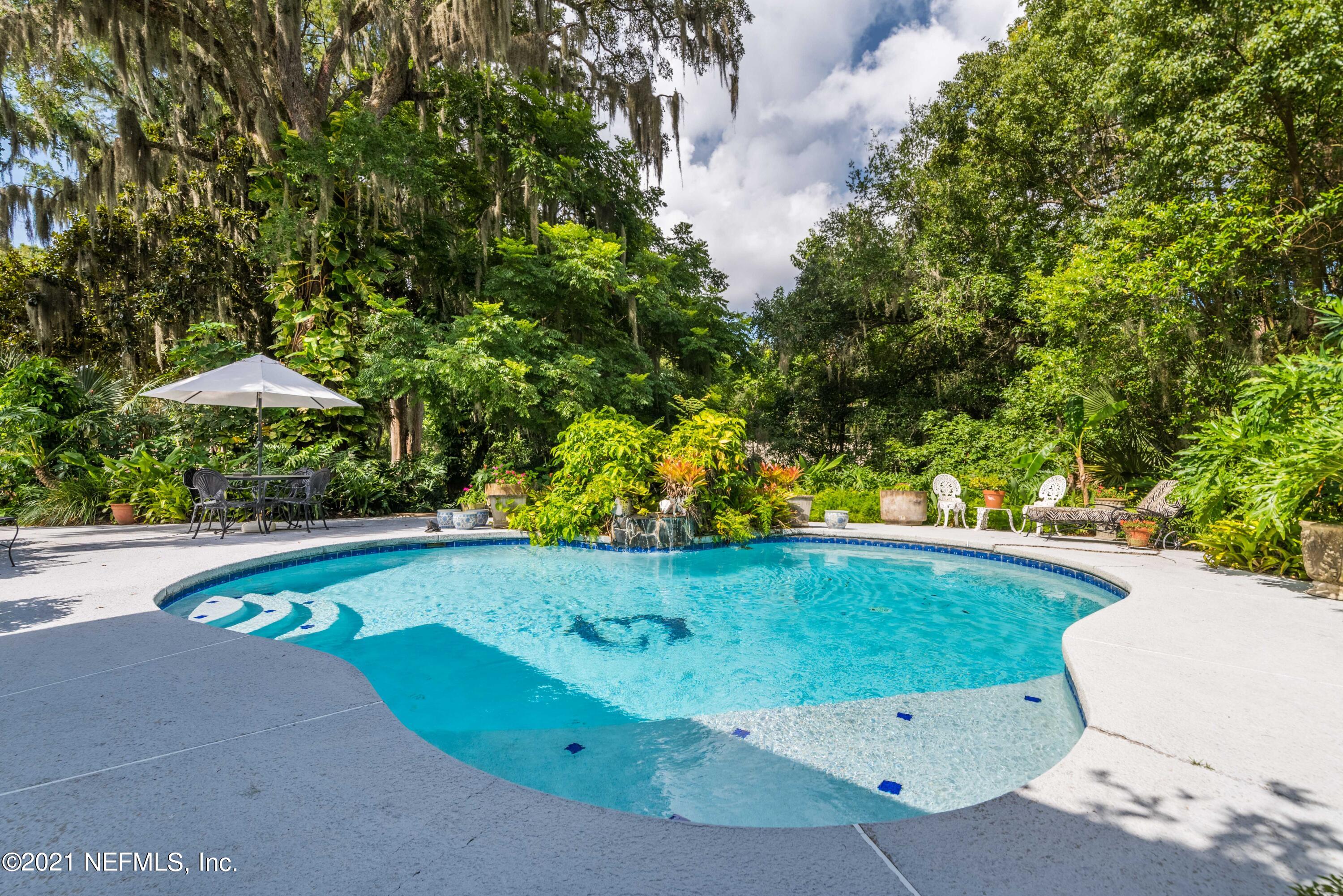 6514 Colgate Road Jacksonville, FL 32217 - Photo 28 of 31 a view of a swimming pool with a yard