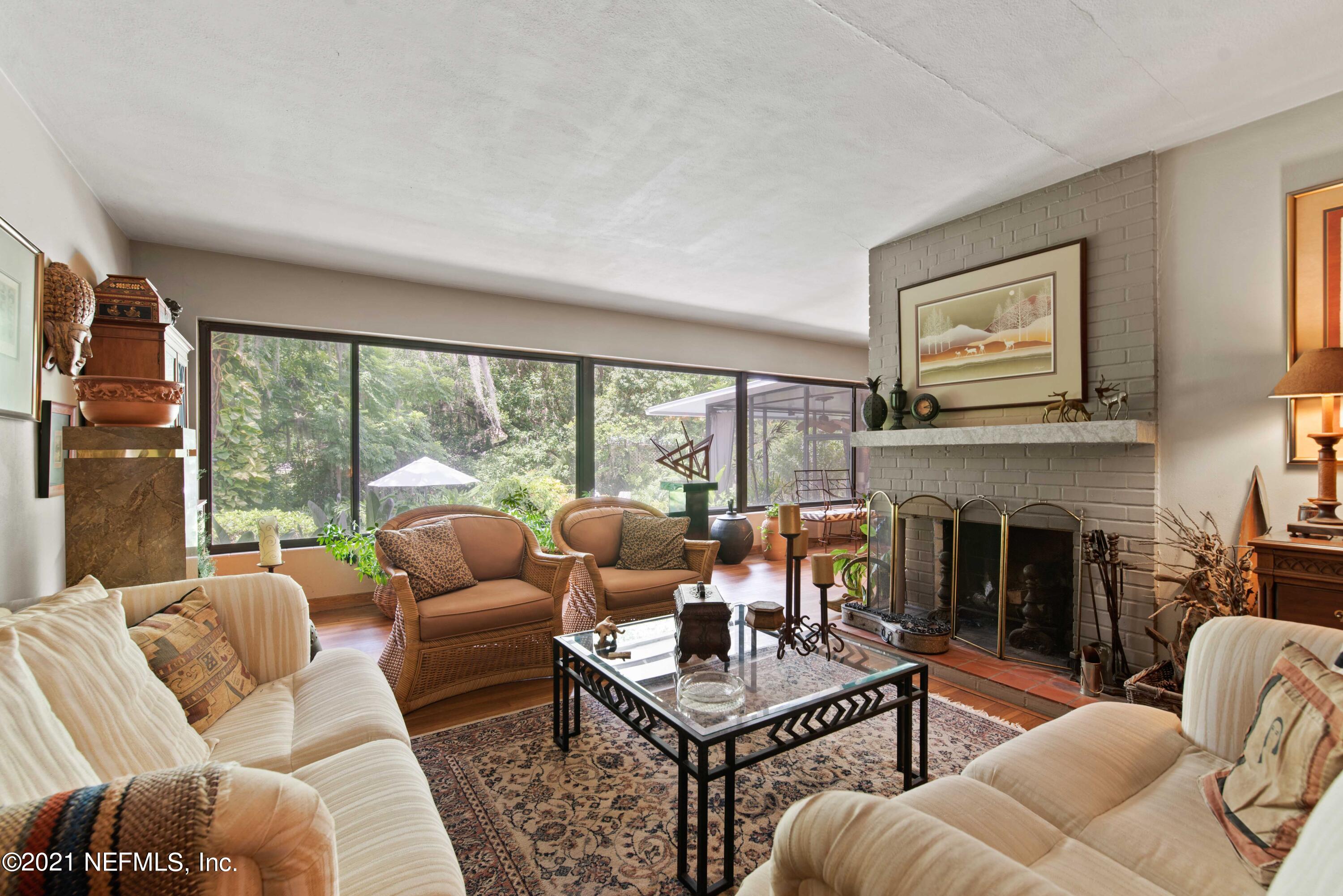 6514 Colgate Road Jacksonville, FL 32217 - Photo 6 of 31 a living room with furniture fireplace and a large window