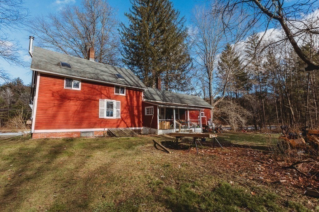 269 Ashfield Road Conway, MA 01341 - Photo 23 of 25 a view of a house with a large tree and a yard