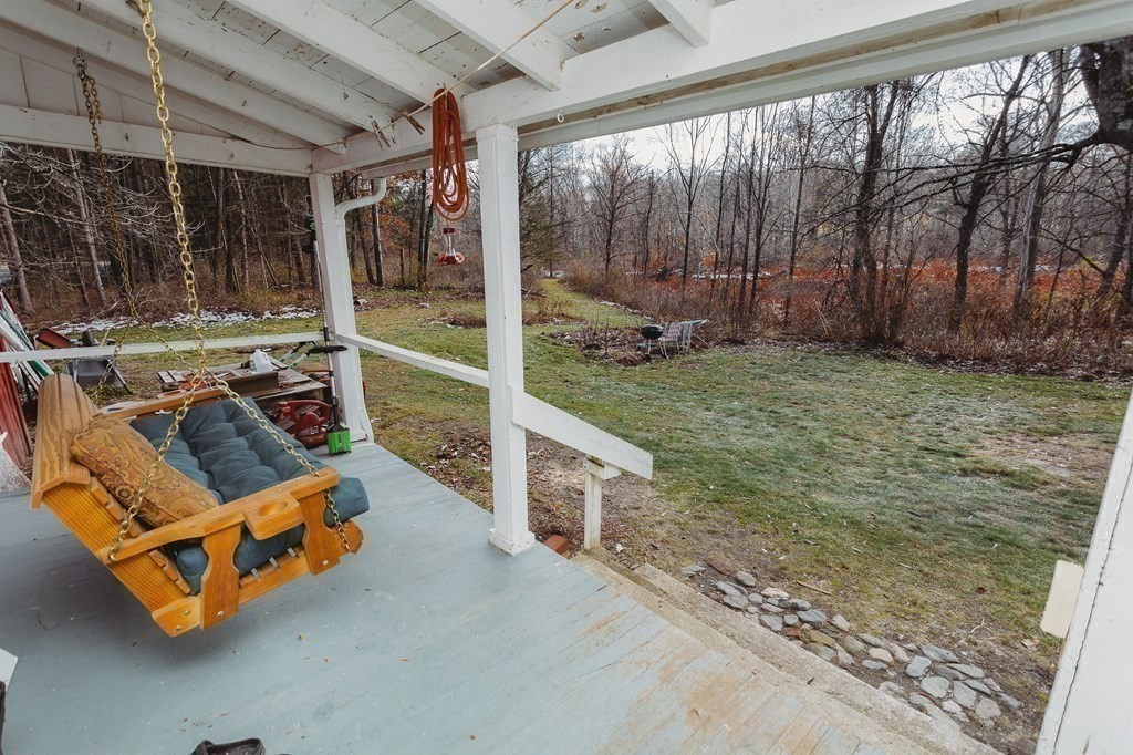 269 Ashfield Road Conway, MA 01341 - Photo 24 of 25 a backyard of a house with garden and outdoor seating