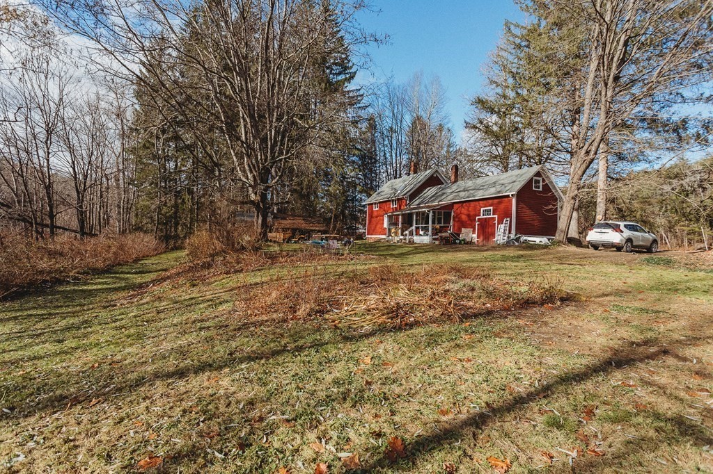 269 Ashfield Road Conway, MA 01341 - Photo 3 of 25 a view of street with houses and trees in the background