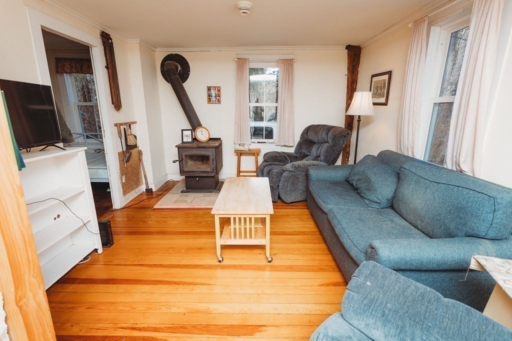 269 Ashfield Road Conway, MA 01341 - Photo 5 of 25 a living room with furniture and a flat screen tv
