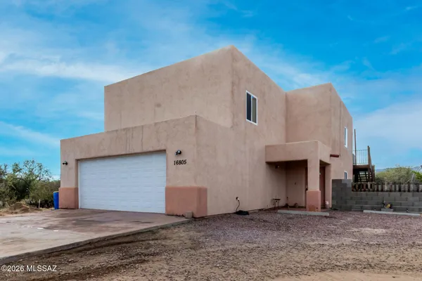 a view of a house with a garage
