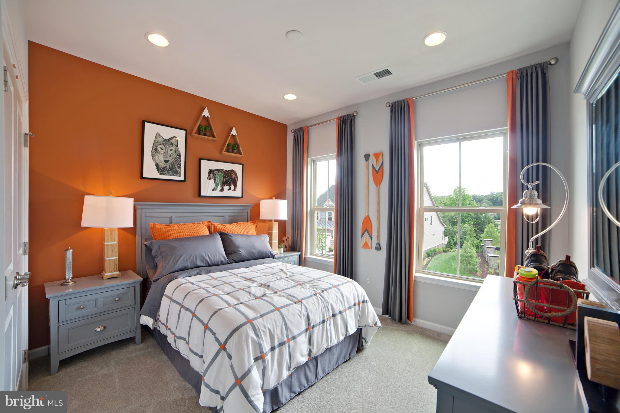 8295 Kippis Road Millersville, MD 21108 - Photo 12 of 28 a bedroom with a bed and a large window