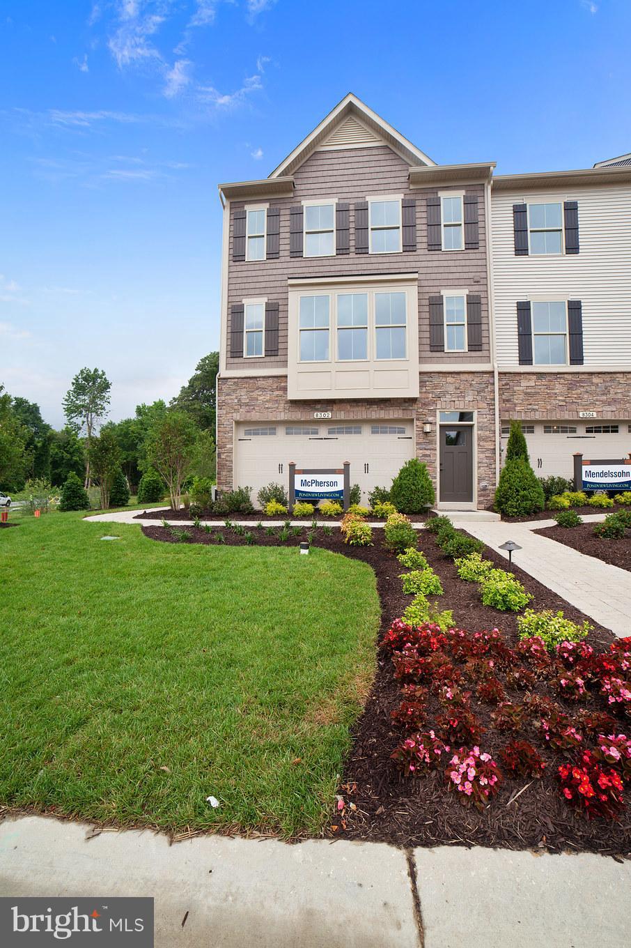 8295 Kippis Road Millersville, MD 21108 - Photo 3 of 28 a front view of a house with a garden