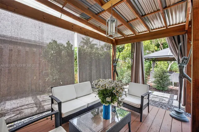 a outdoor living space with furniture and garden view