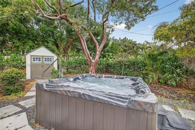 a sign board with a tree in the background