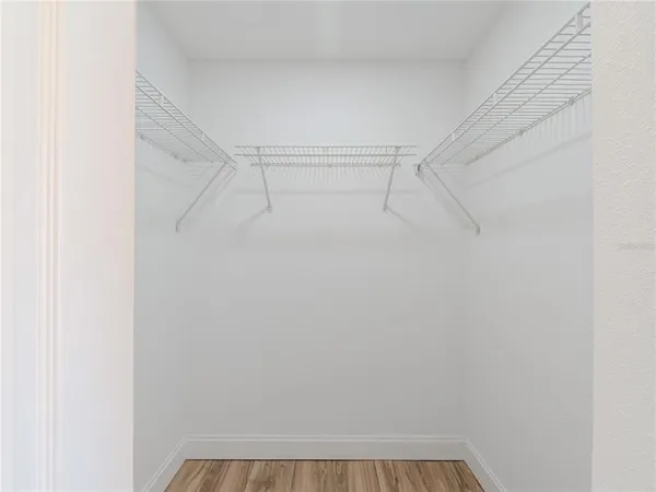 a view of an empty walk in closet