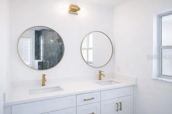 a bathroom with a sink and a mirror