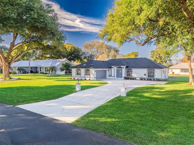 a view of a kitchen with a sink and a refrigerator