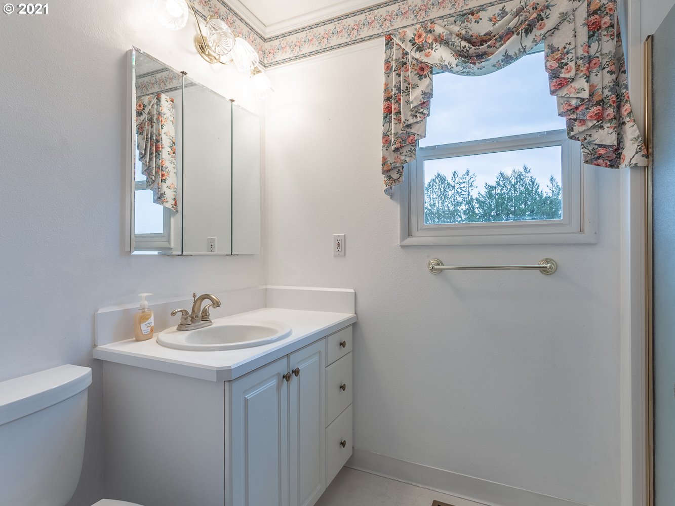 22835 Southeast Tillstrom Road Damascus, OR 97089 - Photo 11 of 32 a bathroom with a sink and a mirror