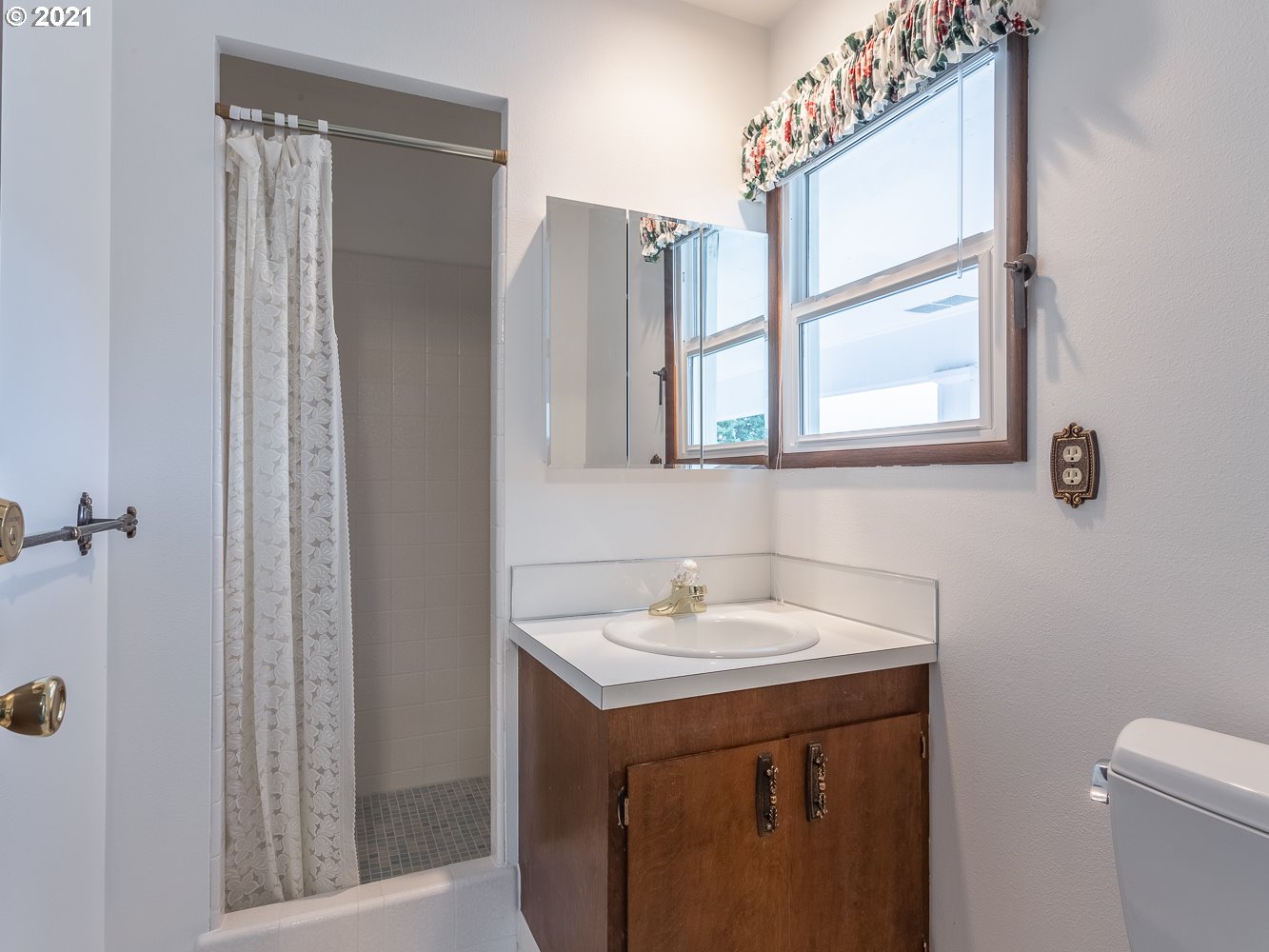 22835 Southeast Tillstrom Road Damascus, OR 97089 - Photo 18 of 32 a bathroom with a sink vanity and a mirror