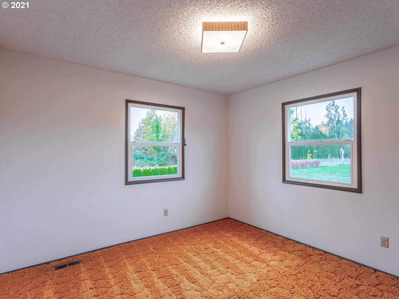 22835 Southeast Tillstrom Road Damascus, OR 97089 - Photo 19 of 32 an empty room with a window