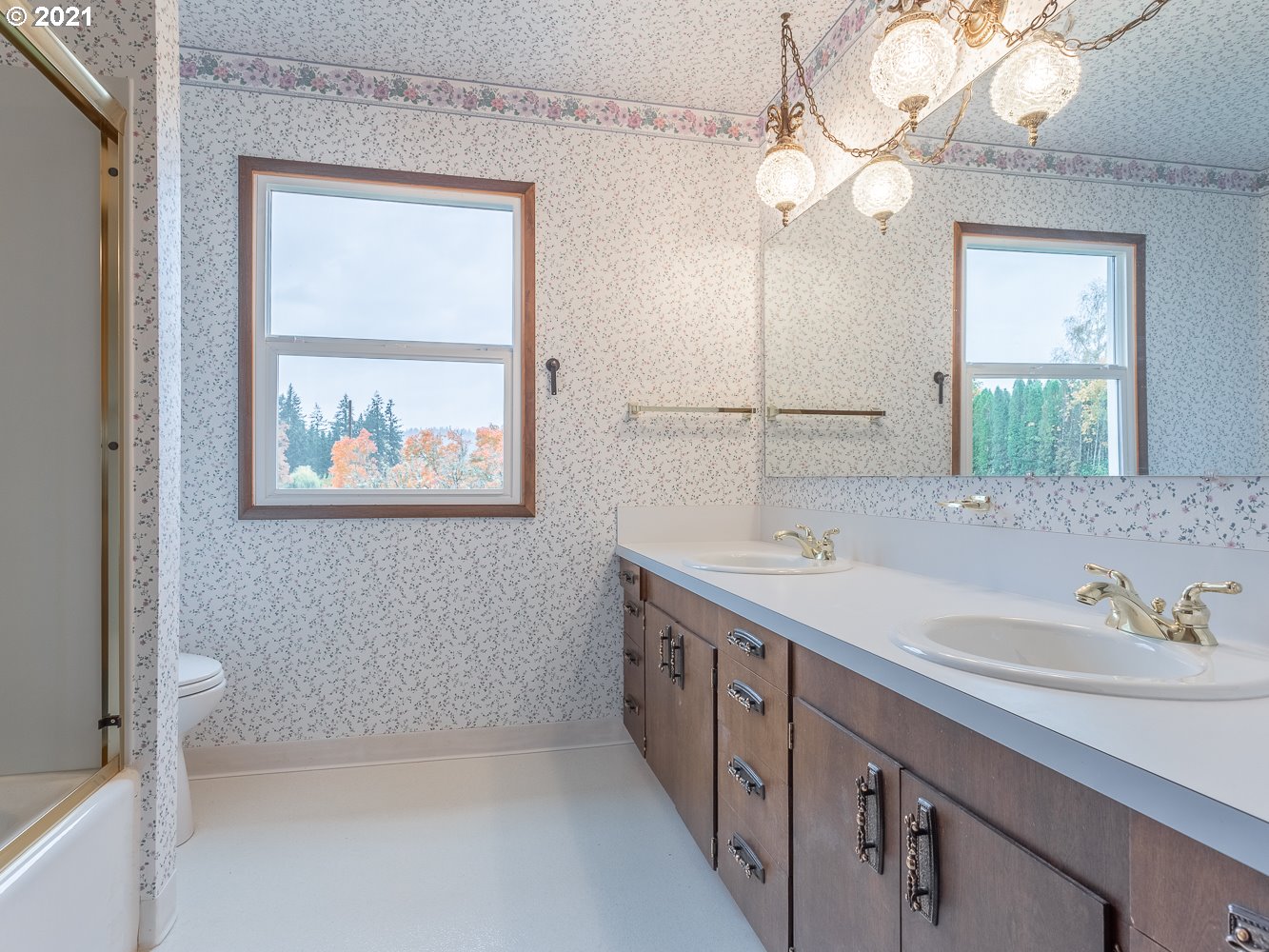 22835 Southeast Tillstrom Road Damascus, OR 97089 - Photo 22 of 32 a bathroom with a double vanity sink mirror and