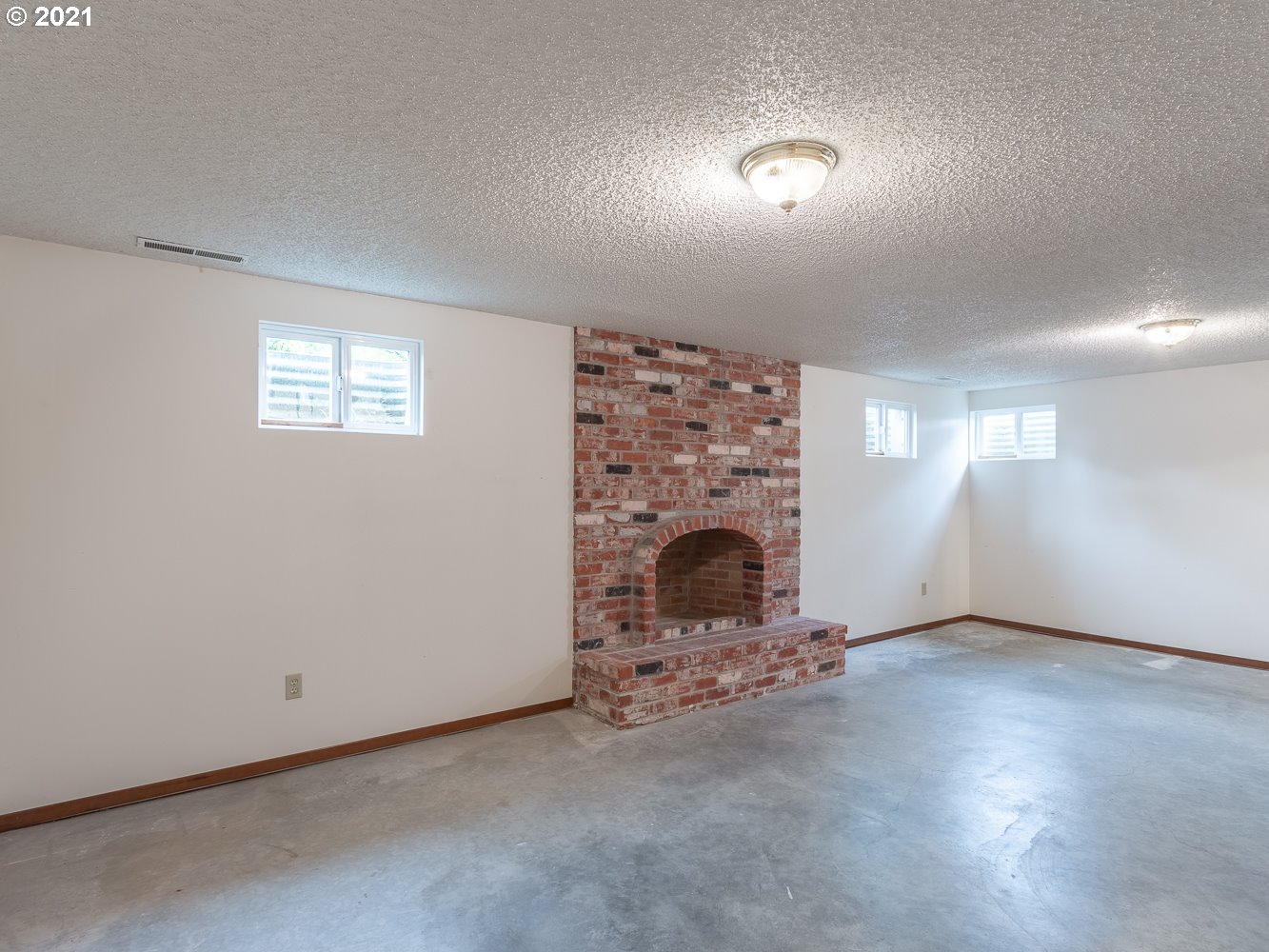 22835 Southeast Tillstrom Road Damascus, OR 97089 - Photo 23 of 32 an empty room with windows and fireplace