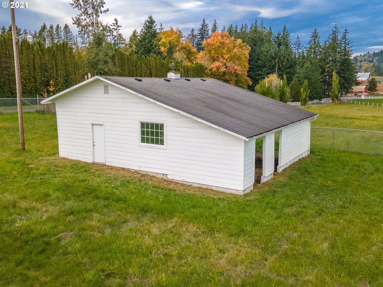 22835 Southeast Tillstrom Road Damascus, OR 97089 - Photo 28 of 32 a aerial view of a house next to a yard and mountain view