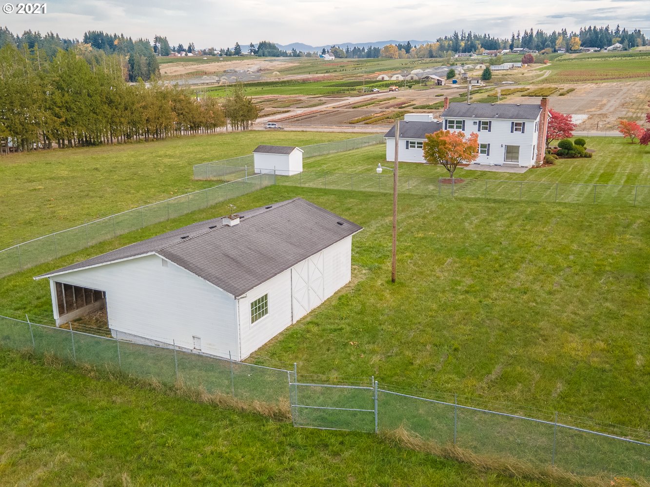 22835 Southeast Tillstrom Road Damascus, OR 97089 - Photo 29 of 32 a view of a house with a yard and a lake view