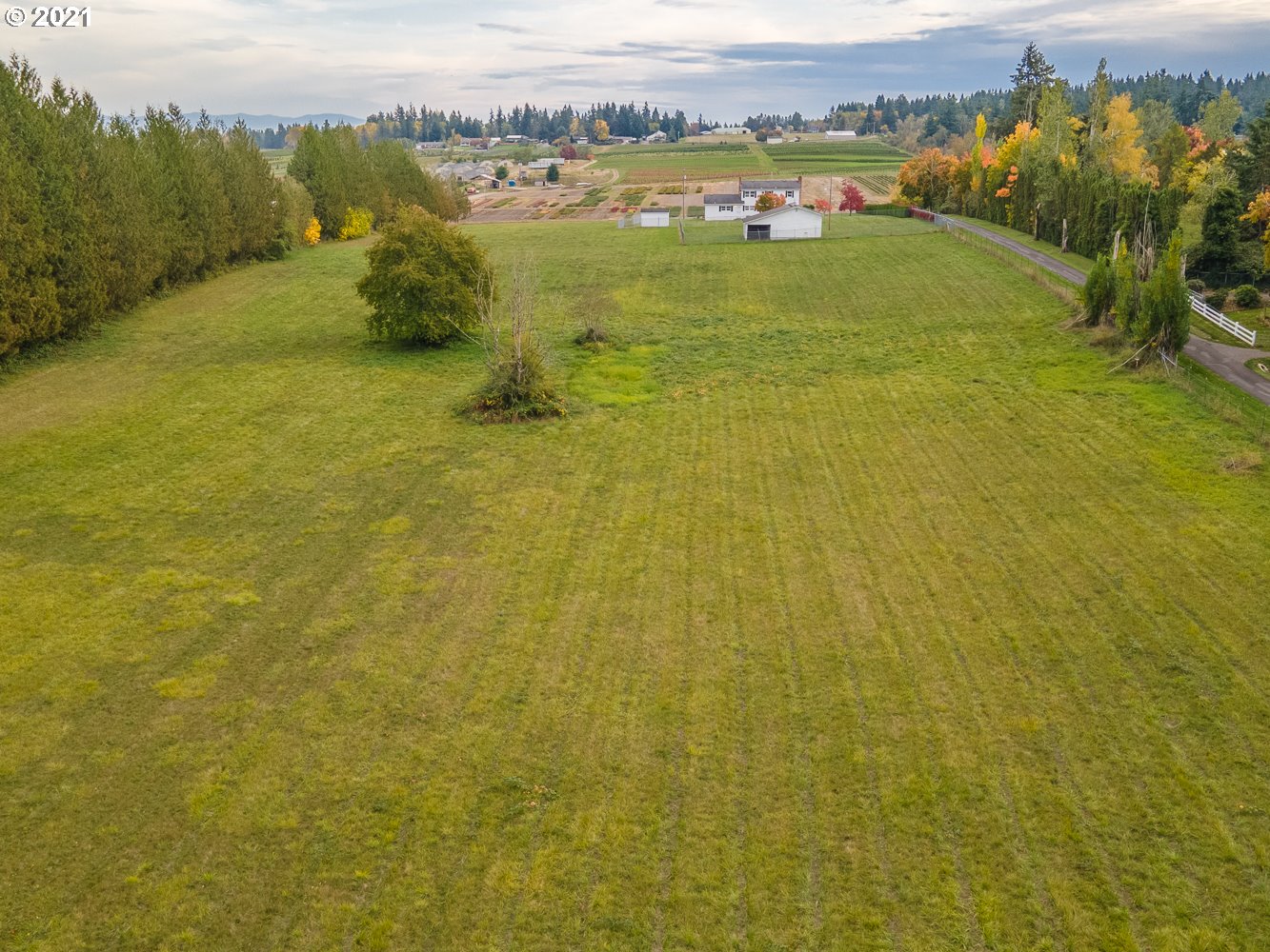 22835 Southeast Tillstrom Road Damascus, OR 97089 - Photo 30 of 32 a view of a lake with houses in the background