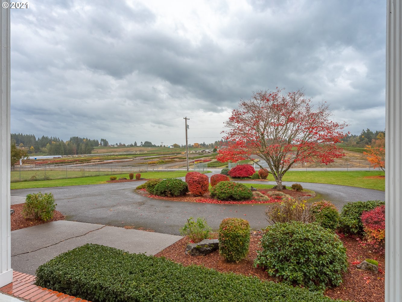 22835 Southeast Tillstrom Road Damascus, OR 97089 - Photo 4 of 32 a view of a lake with a big yard