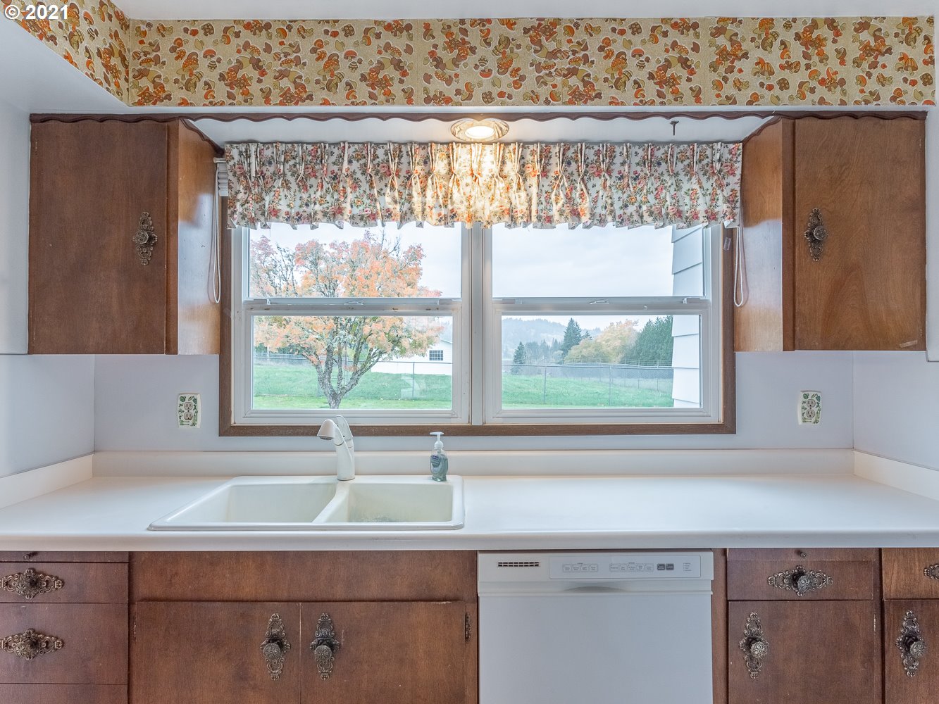22835 Southeast Tillstrom Road Damascus, OR 97089 - Photo 9 of 32 a sink with a window and a kitchen