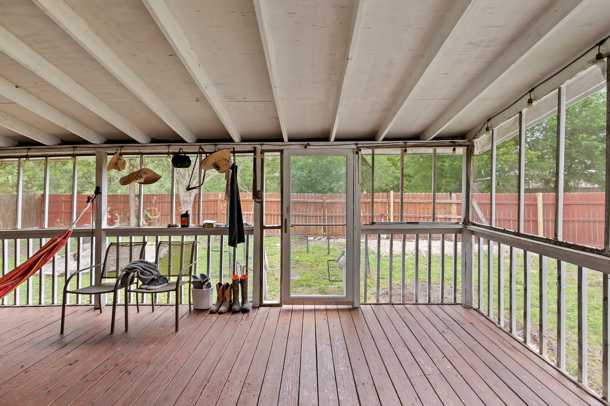 11737 Rydalwater Lane Austin, TX 78754 - Photo 35 of 40 Screened-in porch featuring wood-finish flooring, a white slatted ceiling, and an exterior screen door