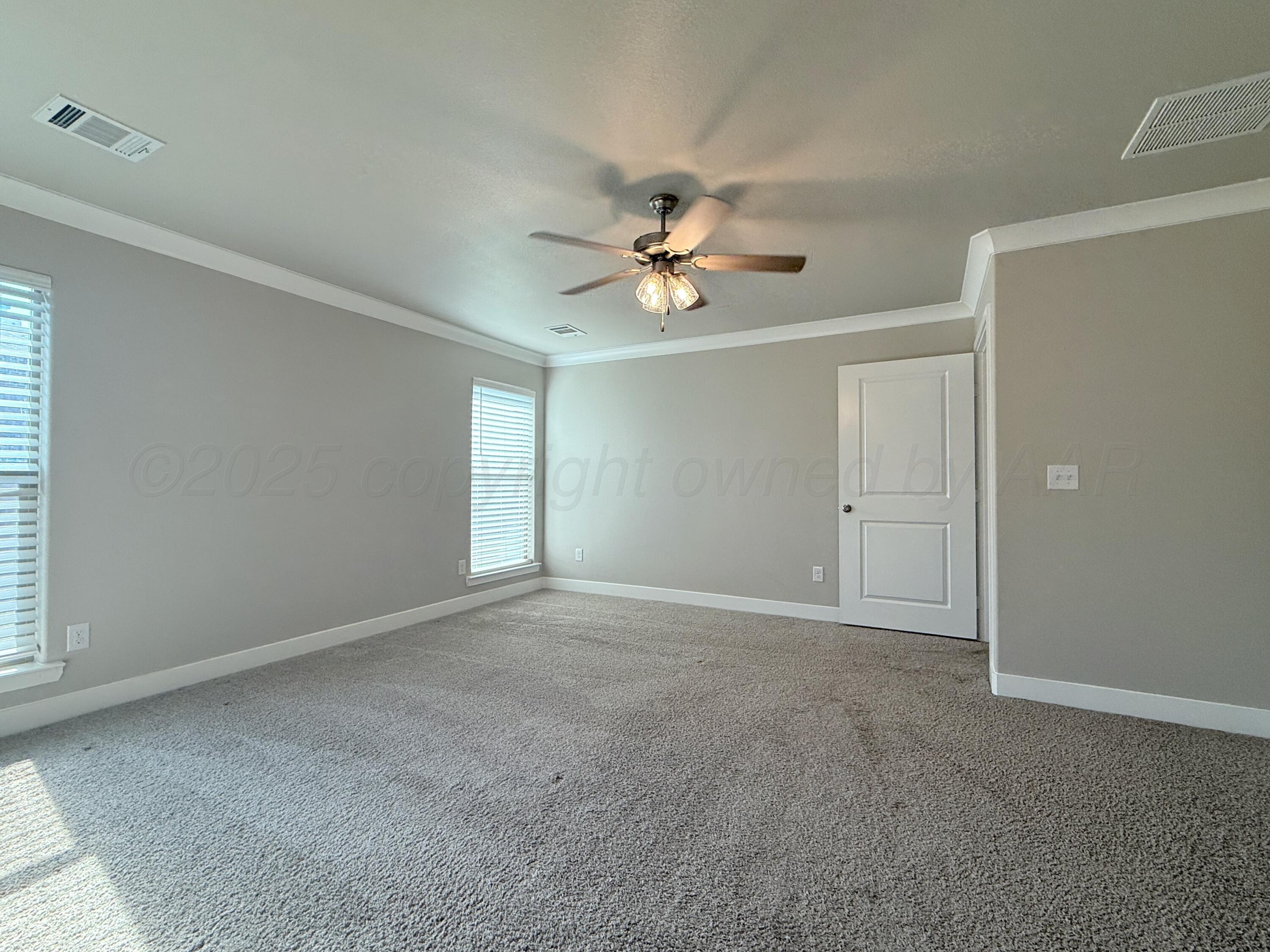 7013 Mercury Trail Amarillo, TX 79118 - Photo 17 of 23 an empty room with windows and fan