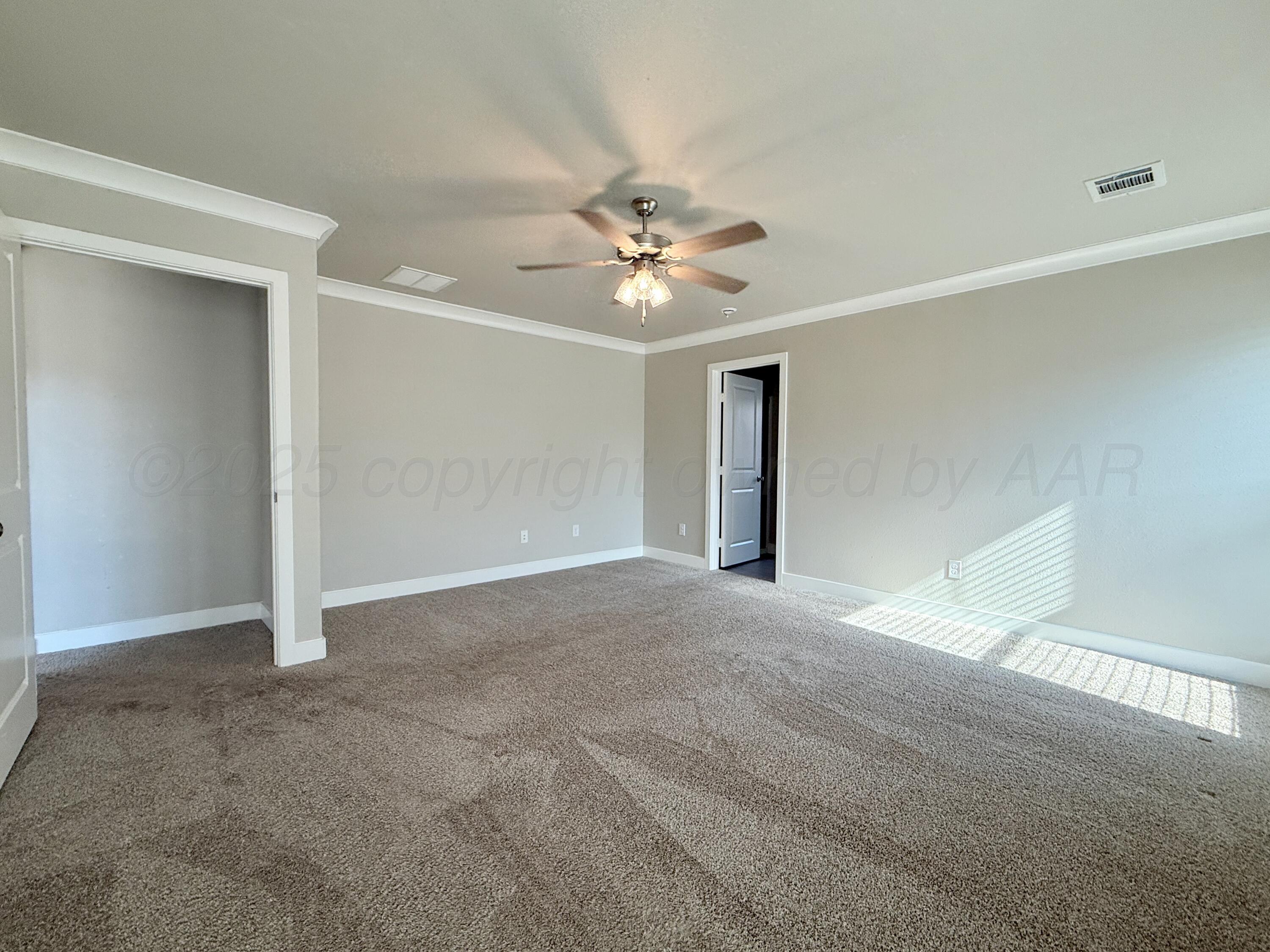 7013 Mercury Trail Amarillo, TX 79118 - Photo 18 of 23 a view of a big room with chandelier fan and windows