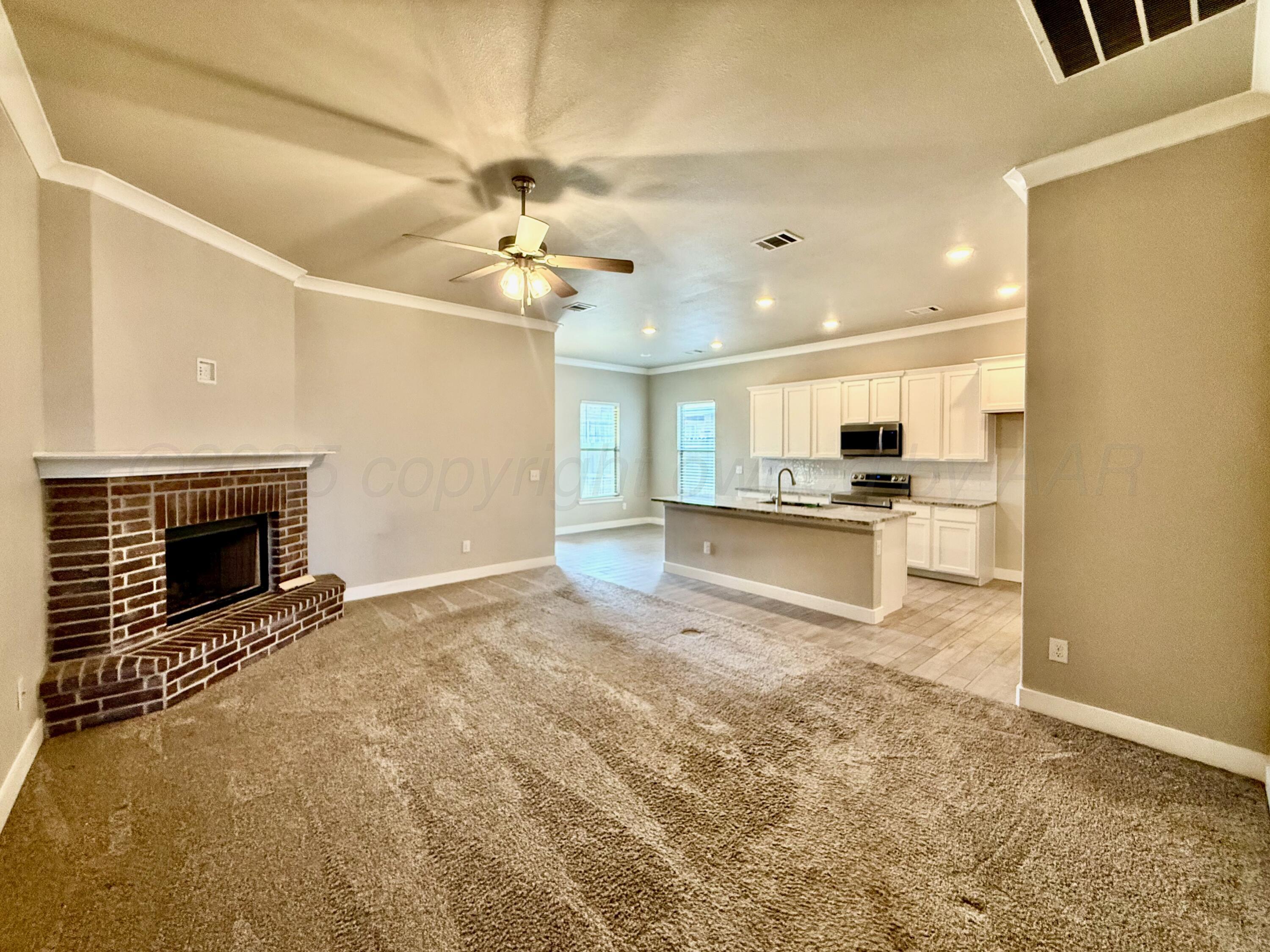 7013 Mercury Trail Amarillo, TX 79118 - Photo 5 of 23 a view of a kitchen with a stove cabinets and a kitchen