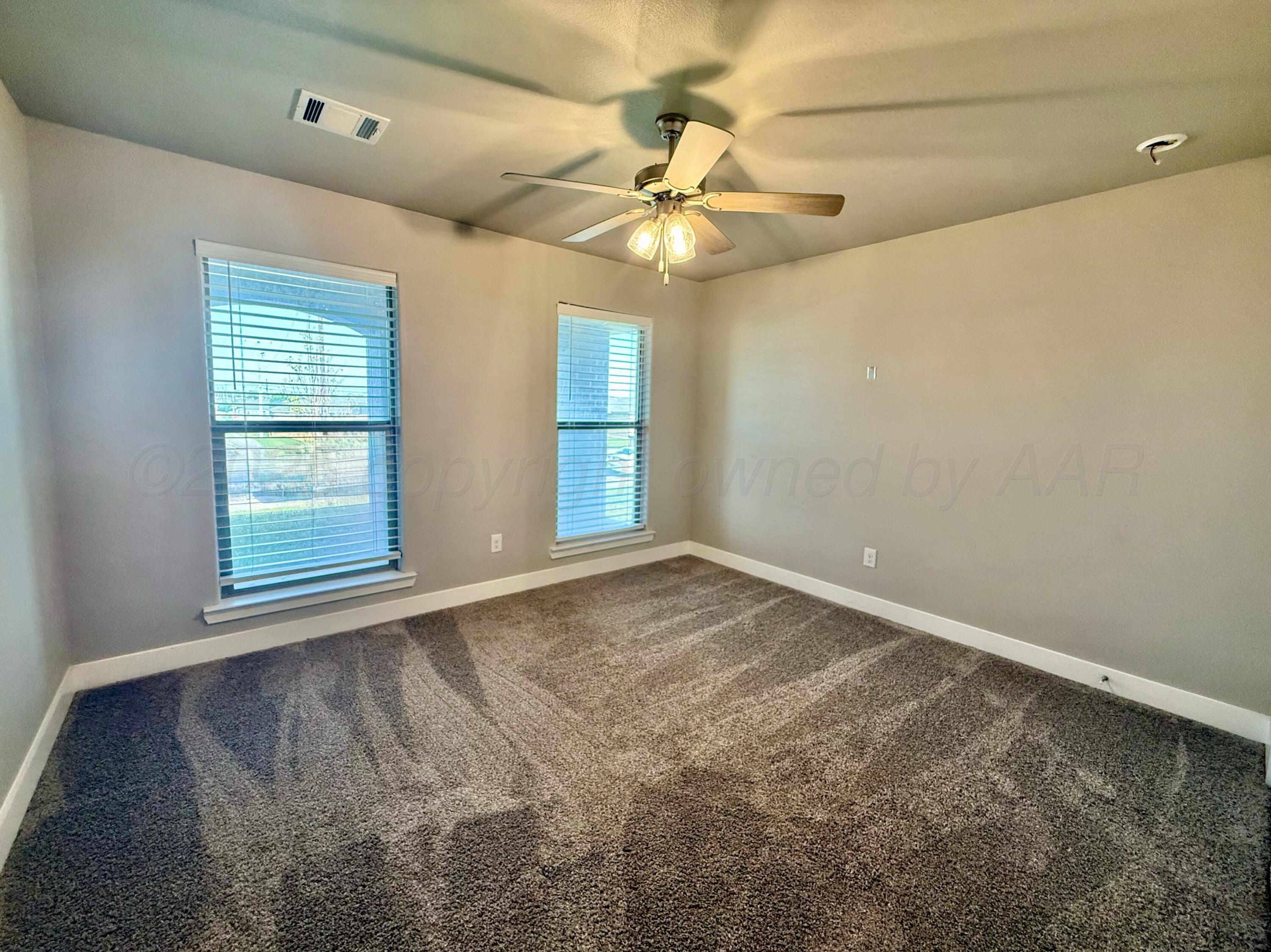 7013 Mercury Trail Amarillo, TX 79118 - Photo 10 of 23 a view of an empty room with a window