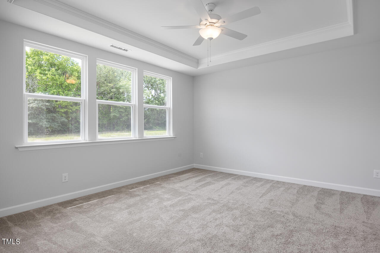 63 Golden Leaf Farms Road, Unit 12 Angier, NC 27501 - Photo 16 of 25 an empty room with a window