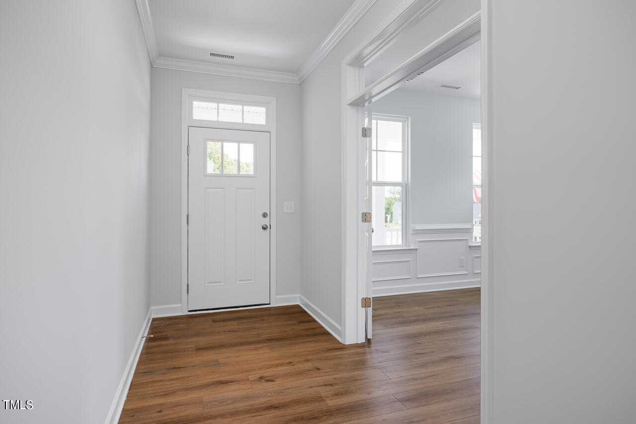 63 Golden Leaf Farms Road, Unit 12 Angier, NC 27501 - Photo 2 of 25 wooden floor in a hall with an entryway