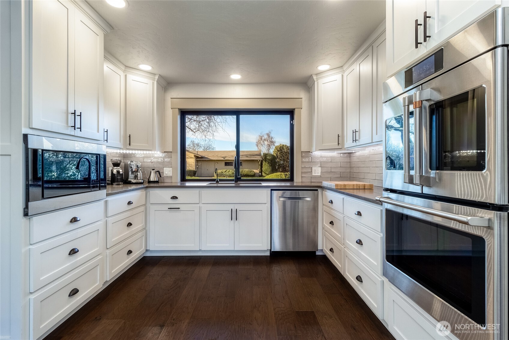 619 Country Club Road Walla Walla, WA 99362 - Photo 11 of 33 a kitchen with granite countertop white cabinets white stainless steel appliances and sink