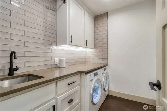 a view of a kitchen sink and cabinets