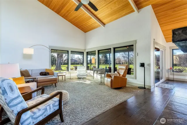 a dining room with furniture and wooden floor