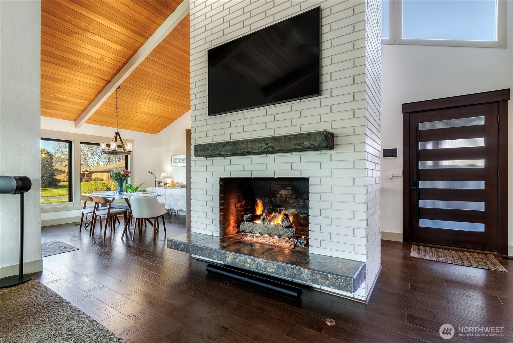 619 Country Club Road Walla Walla, WA 99362 - Photo 6 of 33 a living room with furniture a flat screen tv and a fireplace