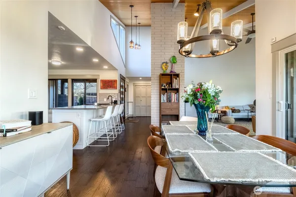 a dining room with furniture and wooden floor