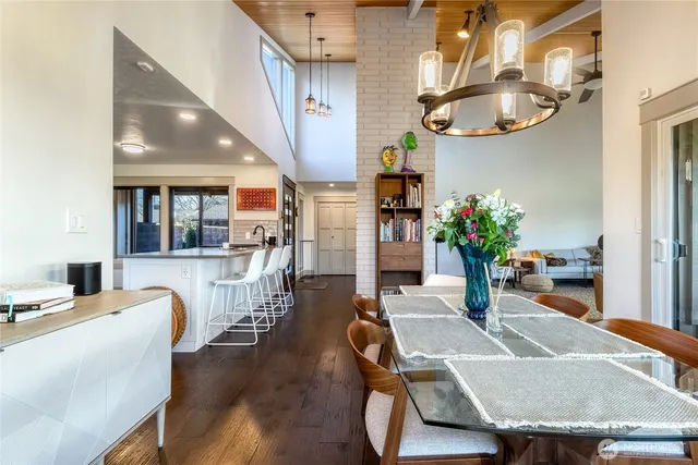 a dining room with furniture and wooden floor