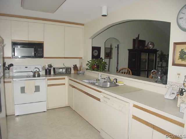 14207 Chimney House Road Midlothian, VA 23112 - Photo 4 of 10 a kitchen with sink and white cabinets