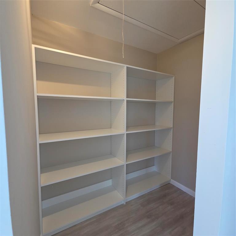 5385 Lake Front Boulevard, Unit A Delray Beach, FL 33484 - Photo 17 of 31 a view of walk in closet with empty racks