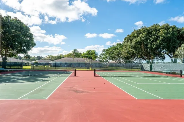 a view of an outdoor space and tennis court