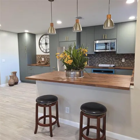 a kitchen with a table and chairs in it