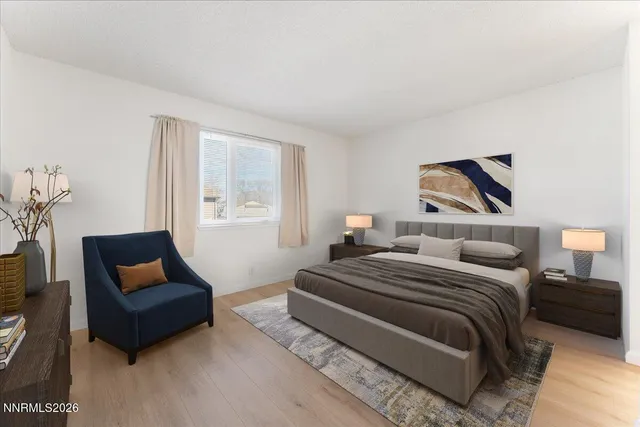 a bedroom with two beds and a couch