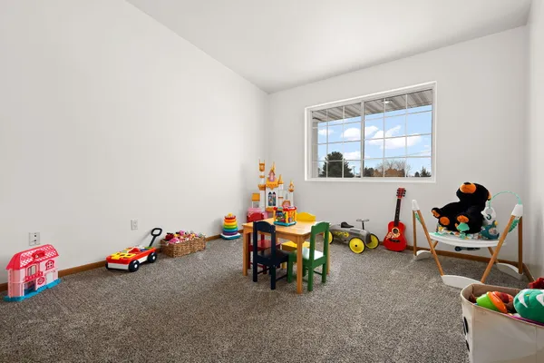 a room with furniture and paintings on the wall