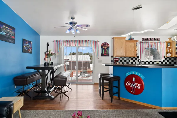 a kitchen with granite countertop a stove and wooden floor